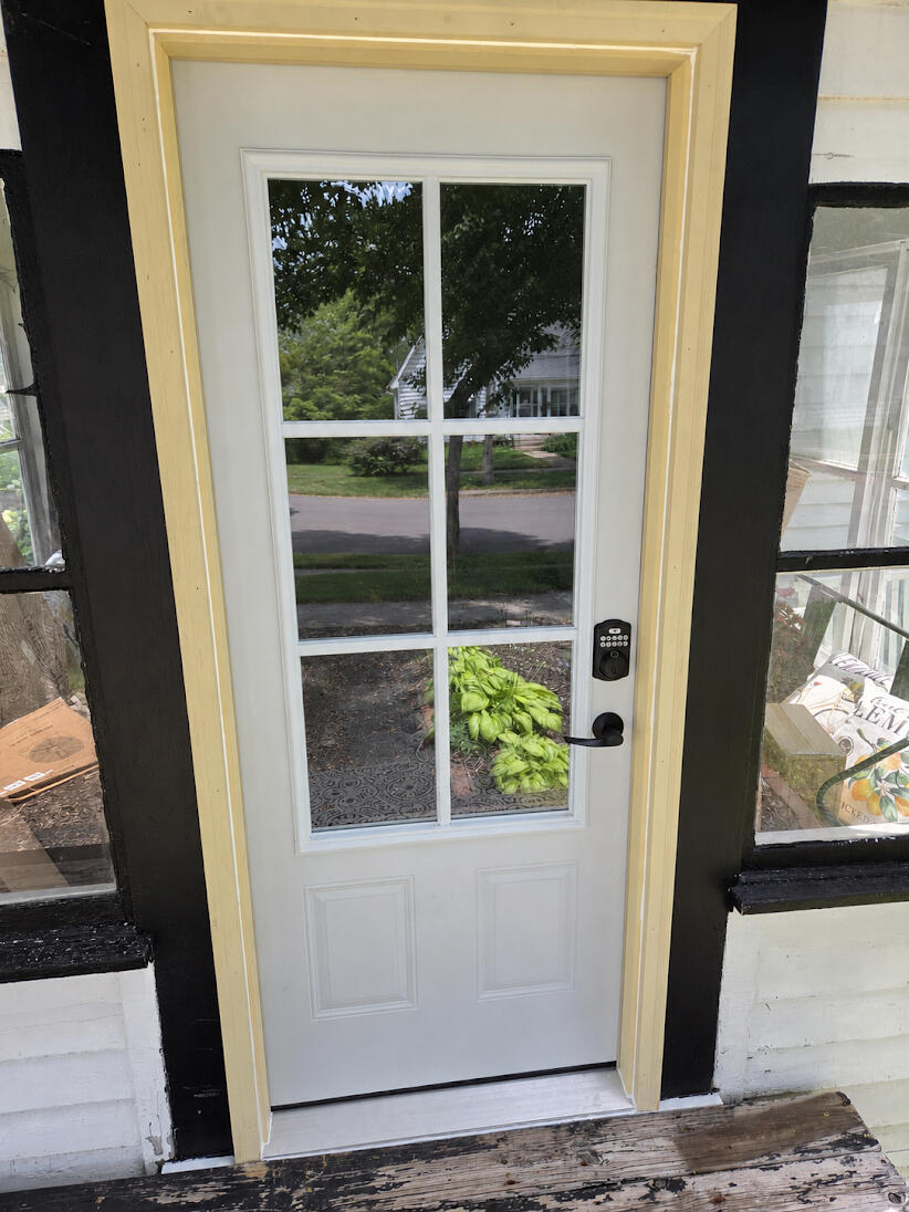 New exterior entry door installed for a secure, weather-tight fit and a clean, finished appearance.